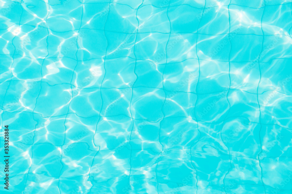 sun reflection on swiming pool water and blue tile background sun reflection on swiming pool water and blue tile background