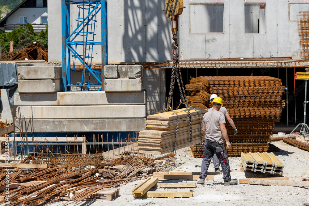 Fototapeta premium Construction workers working on construction site