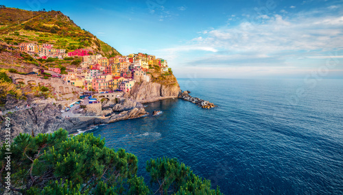 Wonderful summer cityscape of Manarola, second city of Cique Terre sequence of hill cities. Nice morning scene of Liguria, Italy, Europe. Picturesqie seascape of Mediterranean sea.