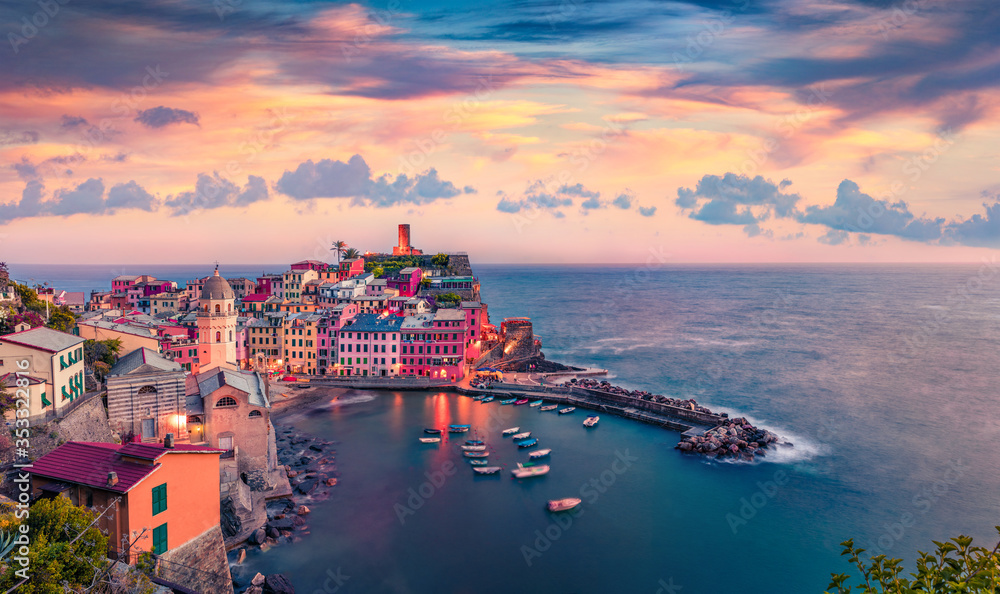Amazing summer cityscape of Vernazza town. Great sunrise on Liguria, Cinque Terre, Italy, Europe. Breathtaking seascape of Mediterranean sea. Traveling concept background.