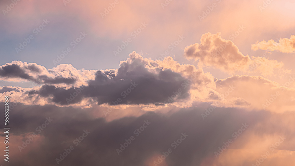 Sun Rays Shining Through Cloudy Sky With Fluffy Clouds. Sunset Sky During Rain.