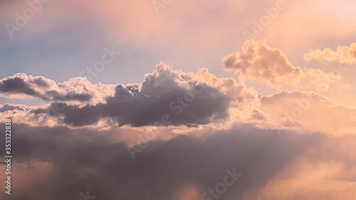 Sun Rays Shining Through Cloudy Sky With Fluffy Clouds. Sunset Sky During Rain. © Grigory Bruev