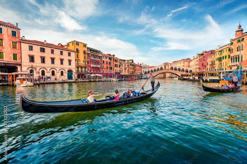 Romantic summer scene of famous Canal Grande. Stunning morning view of Rialto Bridge. Picturesque cityscape of  Venice with tourist on gondolas, Italy, Europe. Traveling concept background. - obrazy, fototapety, plakaty 