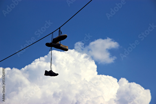 old shoes hanging on wires
