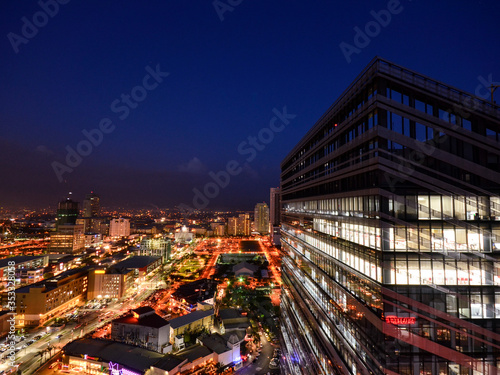 Fort Bonifacio, Metro Manila, Philippine: Shopping centers in BGC and Modern Office tower in right. Evening shot. photo