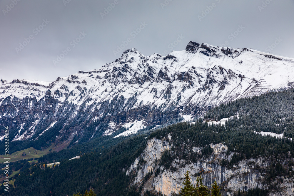 Snow capped mountains in Switzerland in winter.