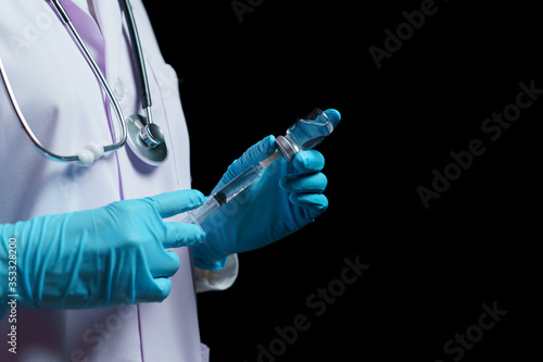 Doctor hand holding coronavirus vaccine shot for diseases outbreak vaccination, medicine and drug concept