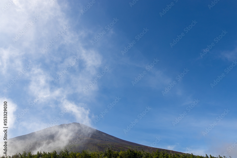 A mountain on the edge of Lake Yamanaka in Japan, foggy in the morning, Lakeside mountains, Yamanaka, in Japan, foggy, early morning, sky, empty space A mountain on the edge of Lake Yamanaka in Japan, foggy in the morning, Lakeside mountains, Yamanaka, in Japan, foggy, early morning, sky, empty space