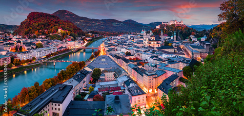 Panoramic evening cityscape of Salzburg, Old City, birthplace of famed composer Mozart. Fantastic autumn scene of Eastern Alps.Splendid landscape with Salzach river. Traveling concept background.