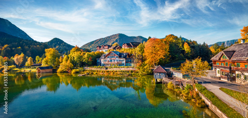 View from flying drone. Stunning morning scene of Grundlsee village and lake. Magnificent autumn view of Eastern Alps, Liezen District of Styria, Austria, Europe. Traveling concept background.