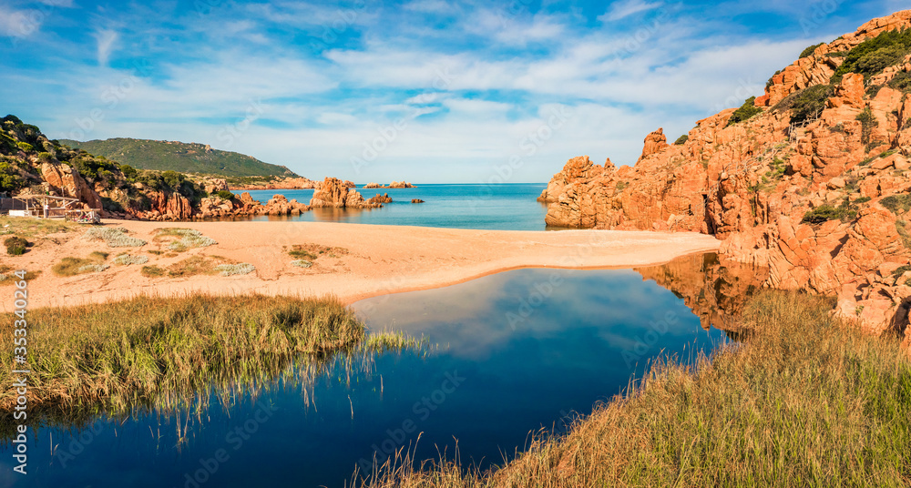 Colorful morning view of Li Cossi beach. Bright summer scene of Costa Paradiso, Sardinia island, Italy, Europe. Sunny Mediterranean seascape. Beauty of nature concept background.