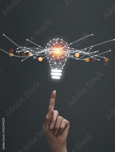 Abstract. Innovation. Hands holding  light bulb future technologies and network connection on virtual interface background, innovative technology in science and communication concept.