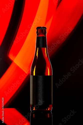 Beer bottle on black background
