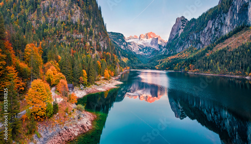 View from flying drone. Captivating autumn view of Gosausee  Vorderer  lake with Dachstein glacieron background. Spectacular evening scene of Austrian Alps  Upper Austria  Europe.