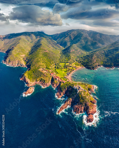 View from flying drone. Spectacular morning scene of Port de Girolata - place, where you can't get by car. Unbelievable summer view of Corsica island, France, Europe. Traveling concept background..