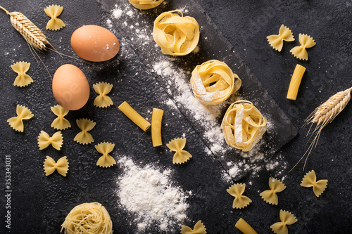 Ingredients for making pasta on a dark background