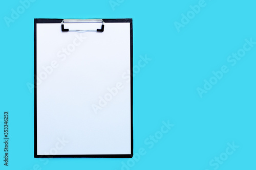 Clipboards with blank white paper sheet on blue background.