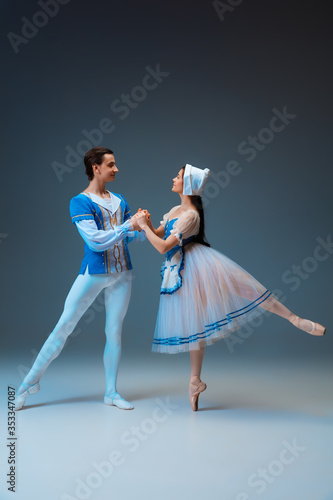 Εκτύπωση καμβά Young and graceful ballet dancers as Cindrella fairytail characters on studio background