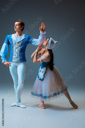 Εκτύπωση καμβά Young and graceful ballet dancers as Cindrella fairytail characters on studio background