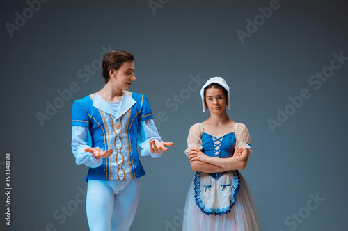 Φωτογραφία Young and graceful ballet dancers as Cindrella fairytail characters on studio background