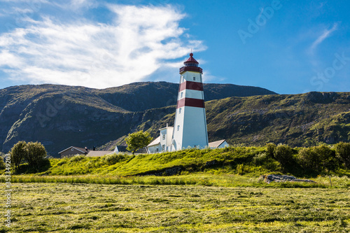 Alnes lighthouse at clear sumer sky at Godoy island near Alesund, Norway