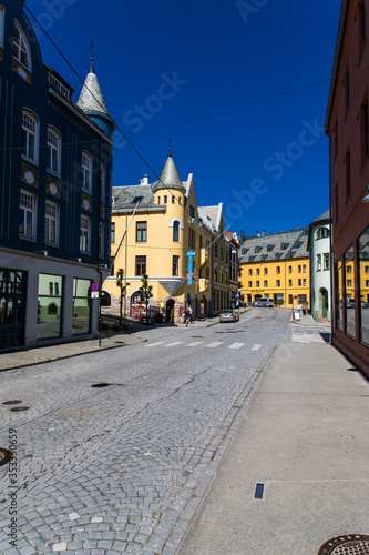 Alesund, Norway - June 2019: Great summer view of Alesund port town on the west coast of Norway, at the entrance to the Geirangerfjord. Old architecture of Alesund town in city centre.