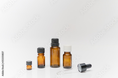 essential oil bottles container brown small aroma oil bottles with white background dropper