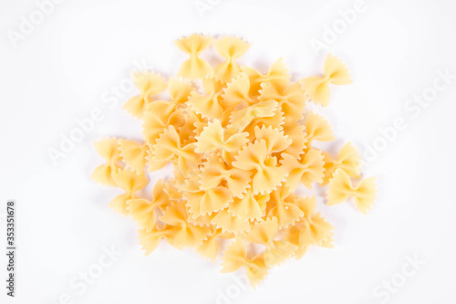 Raw Farfalle pasta on a white background