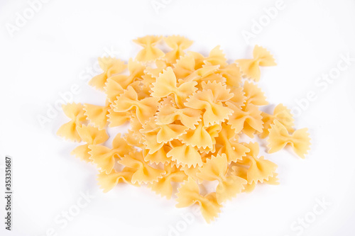 Raw Farfalle pasta on a white background