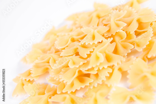 Raw Farfalle pasta on a white background