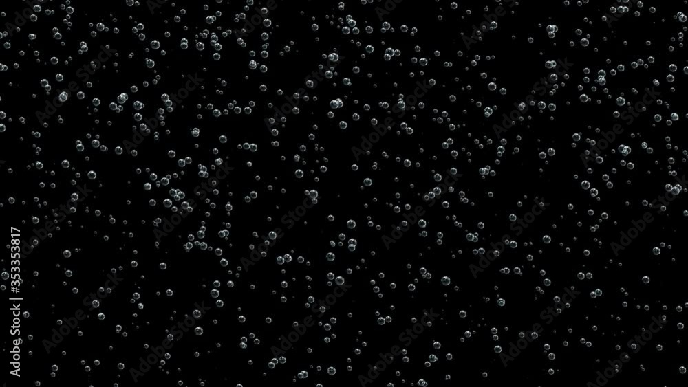 Small bubbles of gas from champagne filled the entire space of the black screen. Small bubbles of gas from champagne filled the entire space of the black screen.