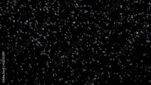 Small bubbles of gas from champagne filled the entire space of the black screen.