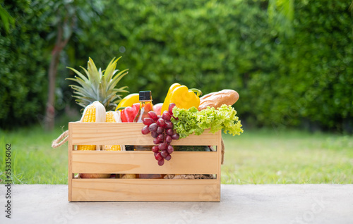 Food on wooden crate fresh healthy eating deliver at home from garden farm online shopping supermarket new nornal life. photo