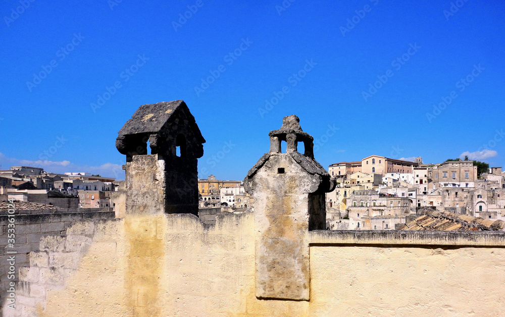 Panoramic view of the ancient town of Matera (Sassi di Matera), European Capital of Culture 2019,and UNESCO Heritage  site  with blue sky and clouds, Basilicata, southern Italy 