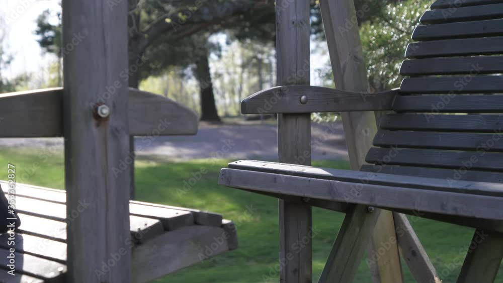 A wooden bench on the park in Helsinki Finland A wooden bench on the park in Helsinki Finland