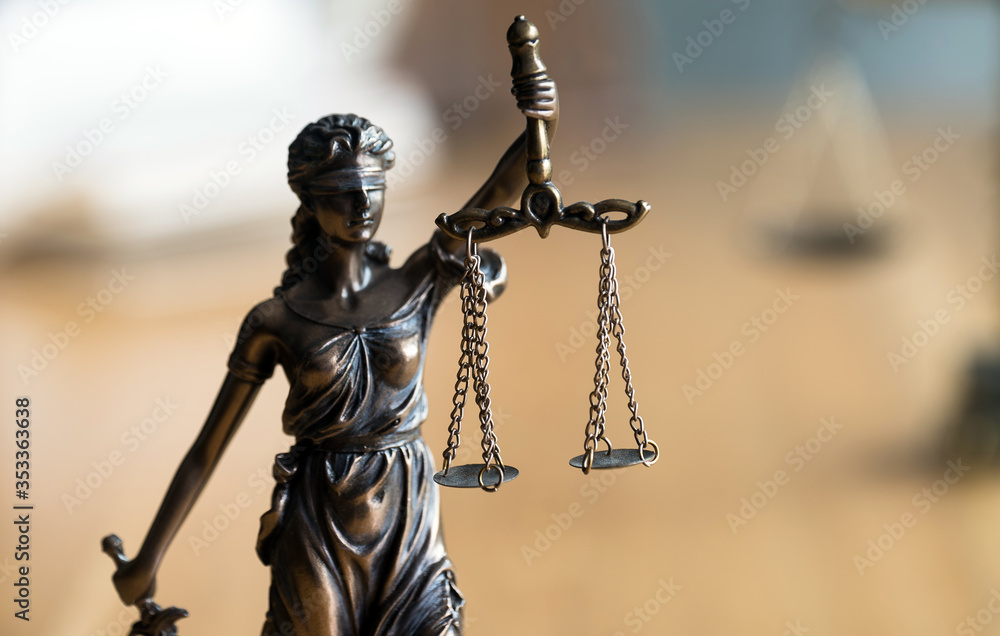 Law and Justice concept. Gavel of the judge, books, scales of justice. Gray stone background. Law and Justice concept. Gavel of the judge, books, scales of justice. Gray stone background.