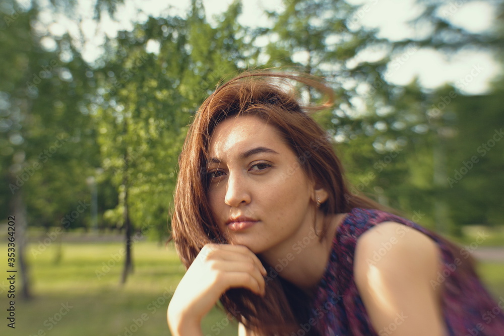 Portrait of a girl in a park.
The face of a beautiful girl close-up. Portrait of a girl in a park.
The face of a beautiful girl close-up.