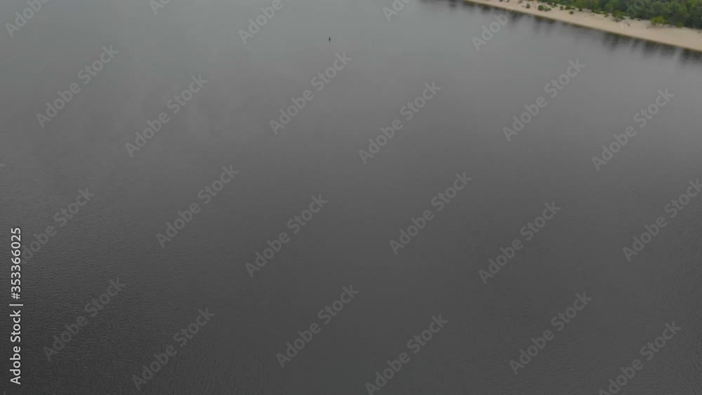 Steel river bridge construction aerial cloudy rainy drone left side tilt up camera movement Dnipro river Kyiv Ukraine Steel river bridge construction aerial cloudy rainy drone left side tilt up camera movement Dnipro river Kyiv Ukraine