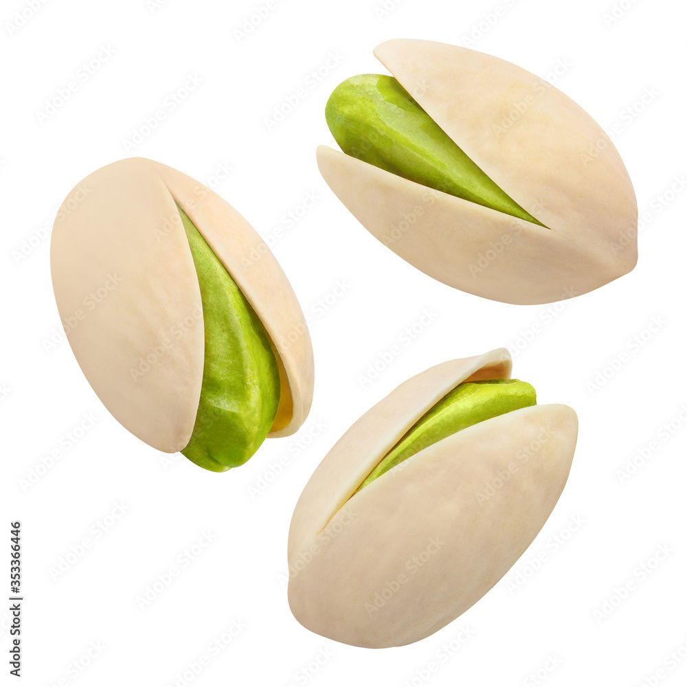Close-up of flying delicious pistachios, isolated on white background - obrazy, fototapety, plakaty 
