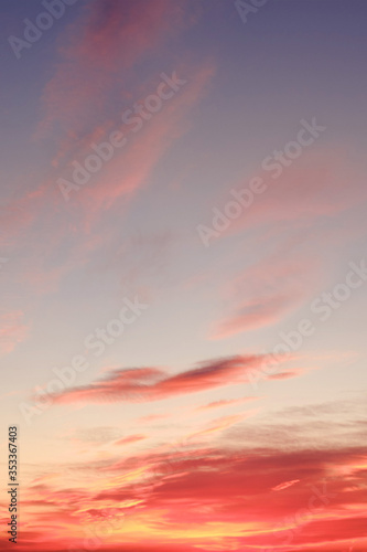 Fototapeta Naklejka Na Ścianę i Meble -  Orange sunset and clouds in a blue sky
