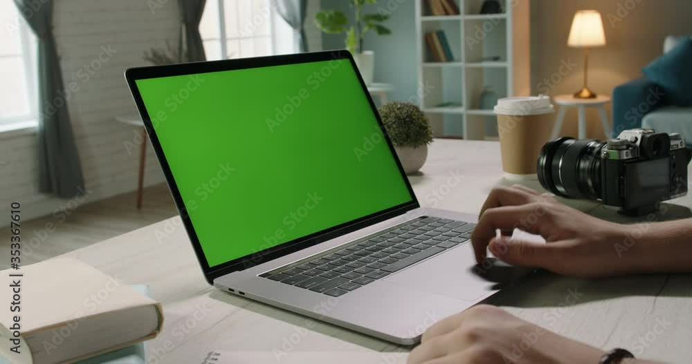 Close up shot of hands of a remote worker working on laptop computer with chroma key green screen, moving finger on trackpad - distance work, technology concept close up 4k template Close up shot of hands of a remote worker working on laptop computer with chroma key green screen, moving finger on trackpad - distance work, technology concept close up 4k template