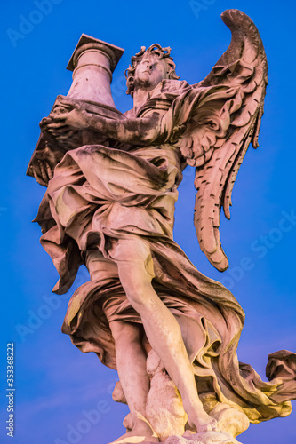 Statue of angel bearing a c...