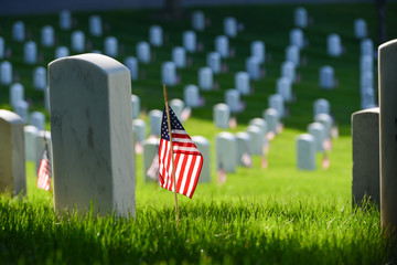 Arlington National Cemetery - Headstones and U.S. National flags - Circa Washington D.C. United States of America