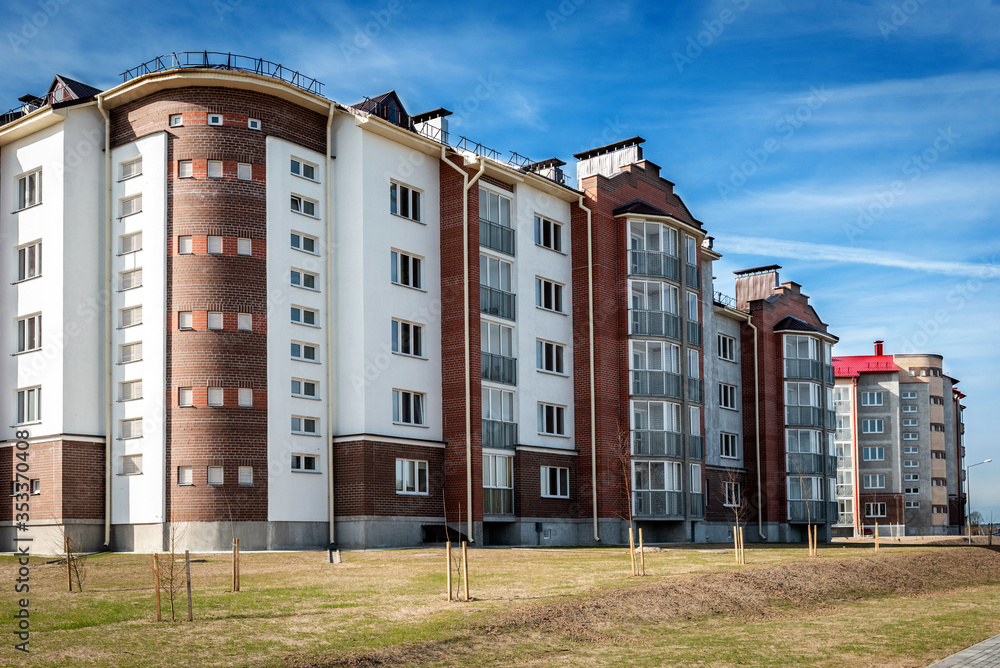 Obraz premium Residential buildings with balconies in the city, urban development of apartment houses.