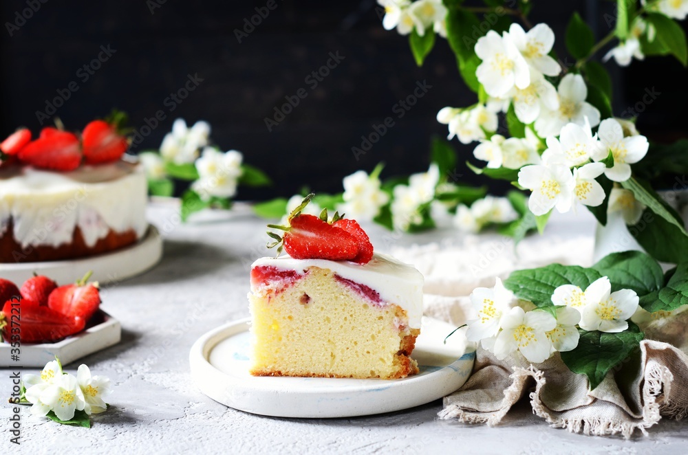 Strawberry cake with cream in a plate on a gray background Strawberry cake with cream in a plate on a gray background