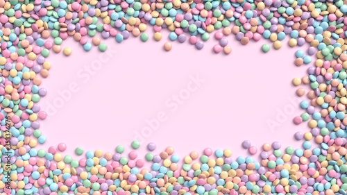 Fotografi Colorful coated chocolate candies frame in pastel tones on bright pink background