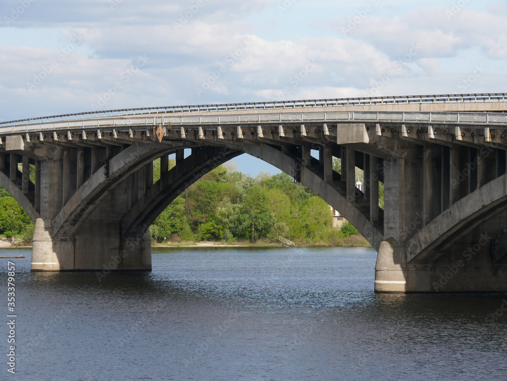 View of the Dnieper river and metro bridge in a cloudy day, Kyiv, Ukraine.