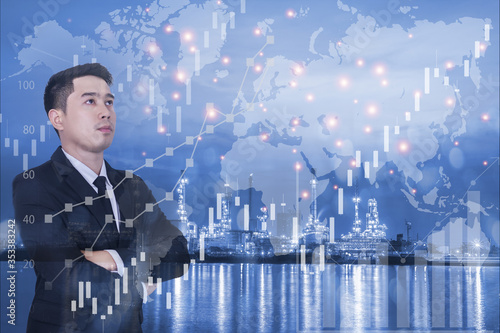 Double exposure photo a businessman and view of Oil refinery or petrochemical industry with ship lokk forex chart and grown up Business. Finance and world of communication concept. photo