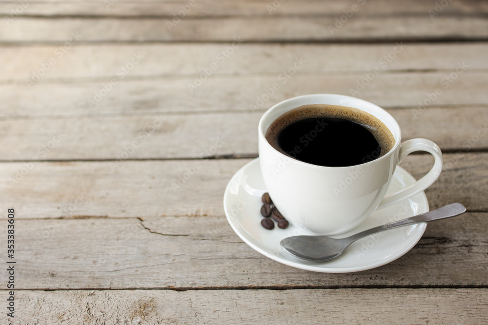 black coffee in a coffee cup isolated on wood background. with clipping path. black coffee in a coffee cup isolated on wood background. with clipping path.