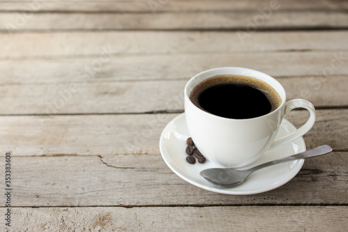 black coffee in a coffee cup isolated on wood background. with clipping path.